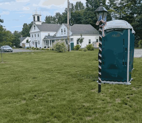 Portable toilet delivered and set up on a lawn in Tampa, Florida